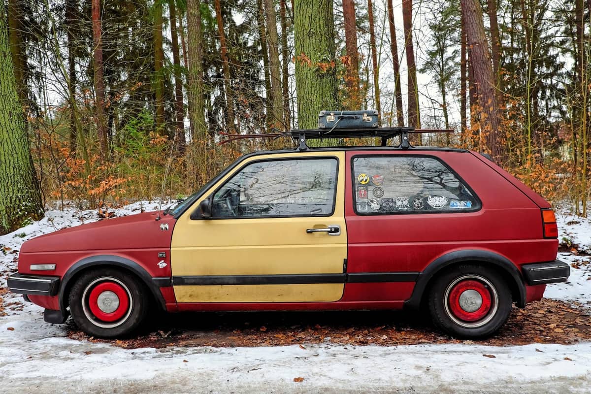 A car parked in a snowy winter forest
