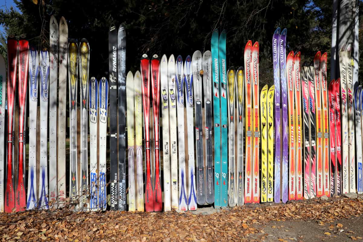 A collection of ski equipment displayed outdoors