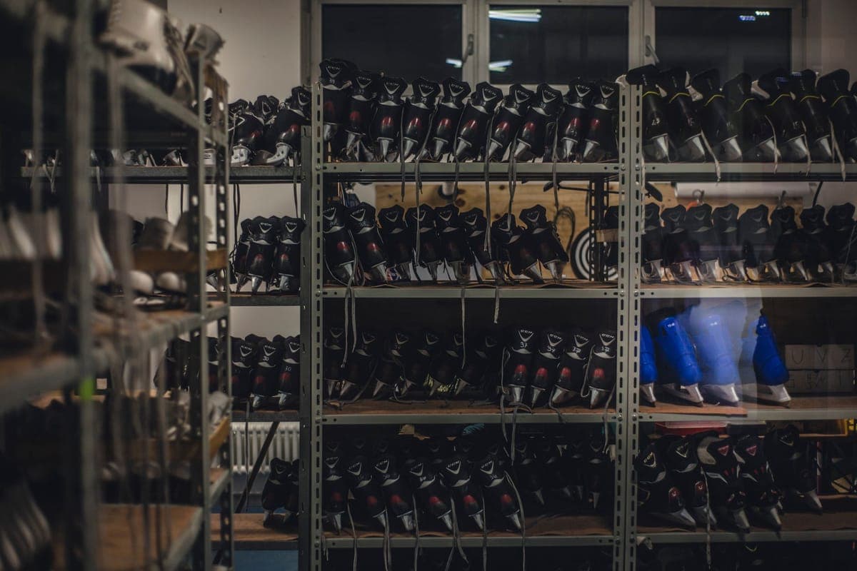Winter sports boots arranged neatly on shelves in an indoor shop