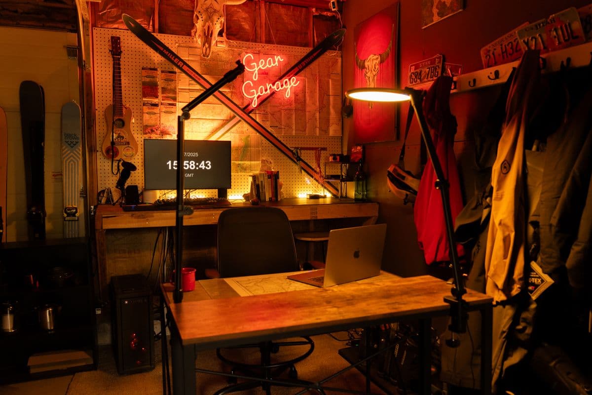 A tidy gear garage workspace with shelving and ambient lighting