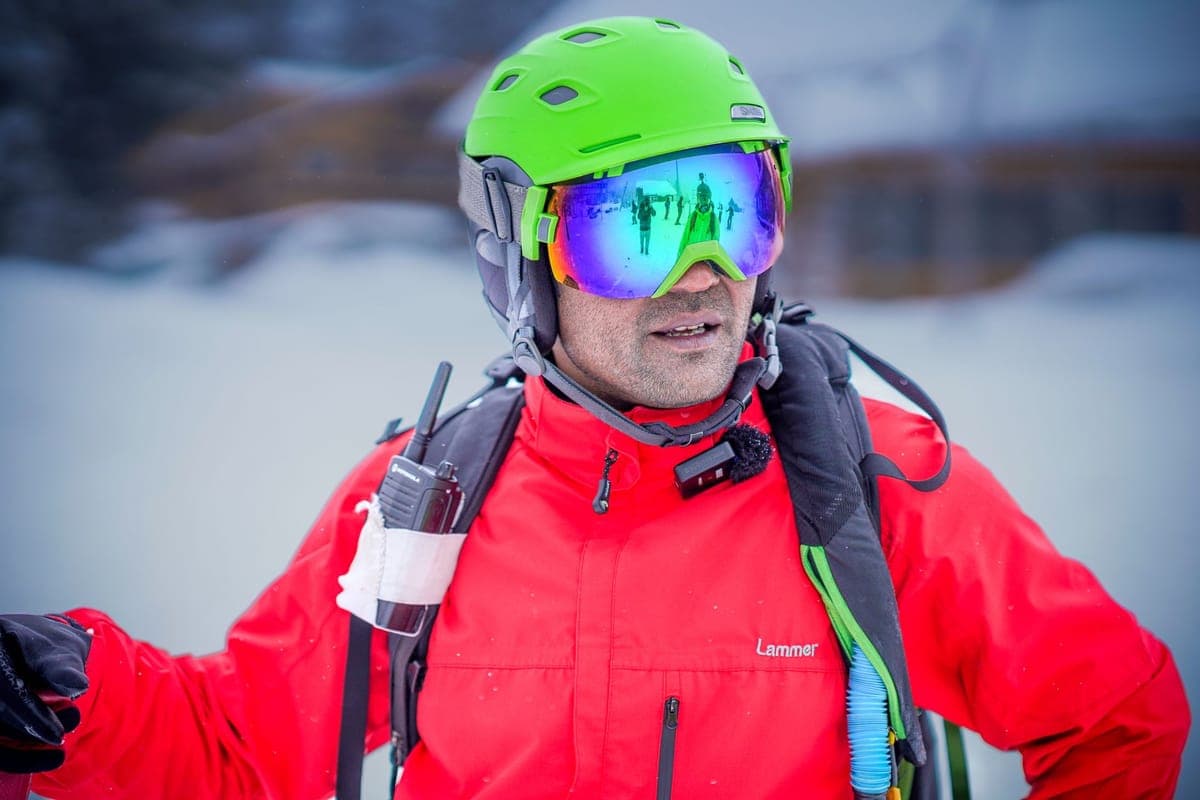 Adult skier wearing a helmet and goggles ready for a winter day outdoors