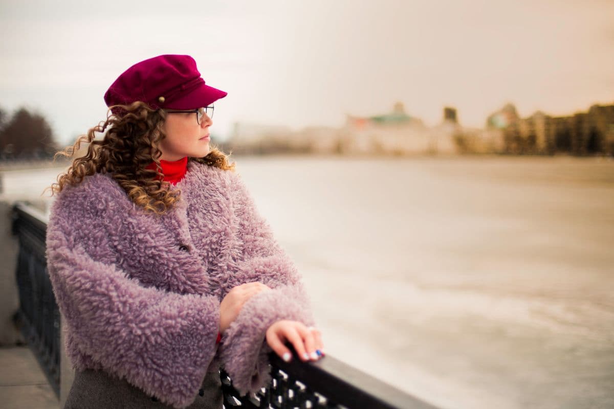 A woman in a fleece coat outdoors on a winter day